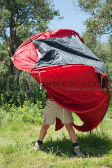 woman pitching tent