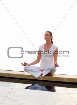 Woman meditating outdoors