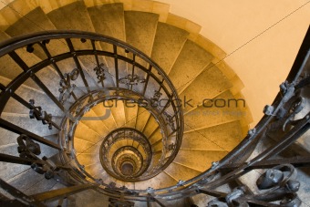 Spiral staircase and stone steps in old tower