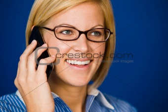 Happy, pretty young woman using cell phone