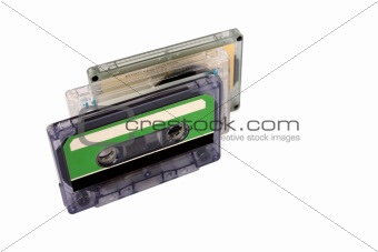 Three Compact Cassette isolated on white. Vertical perspective view