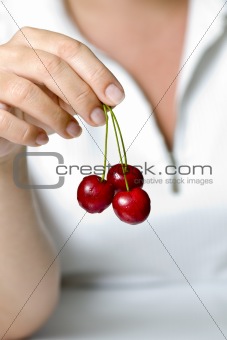 cherries in fingers