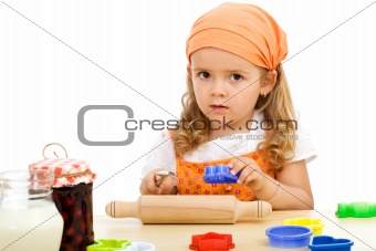 Little girl preparing to make cookies