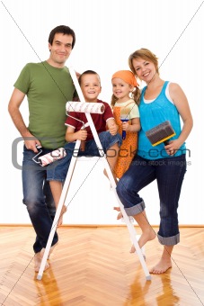 Happy family with painting utensils