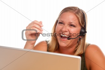 Attractive businesswoman Laughs as she talks on her phone headset.