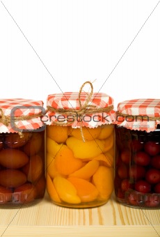Canned fruits on the shelf - isolated