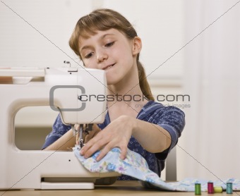 Girl on Sewing Machine