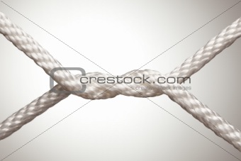 Nylon Rope Knot on a Spot Lit Background.