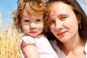 Mom and daughter in wheat