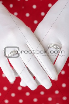 woman showing hands wearing two diamond rings