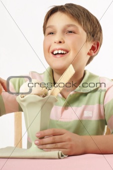 Smiling boy with an ice cream desert