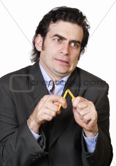 Business man stressed to the max breaking a pencil in angst