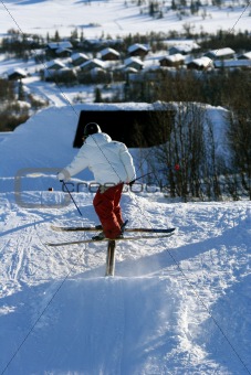 Skier sliding a rail