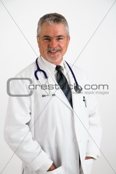 Doctor smiling with hands in pockets