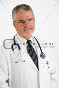 Doctor smiling with hands in pockets