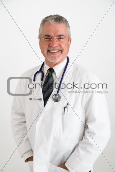 Doctor with hands in pockets with big smile