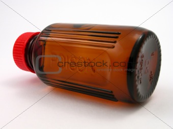 small poison bottle with red cap