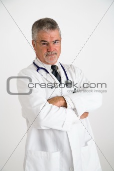 Doctor with arms crossed and concerned look