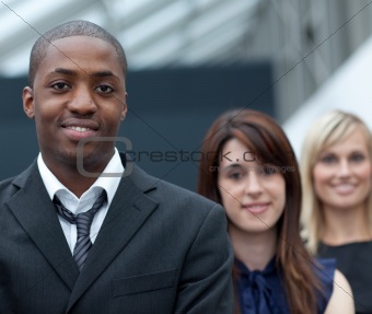 Afro-American businessman in front of his colleages