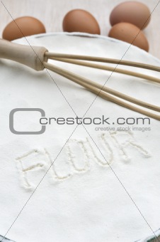 Word "flour" handwritten in flour