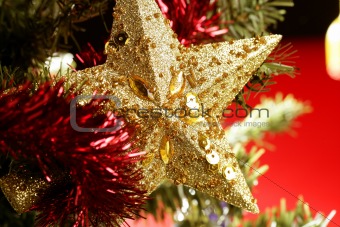 Christmas star decoration still on red background