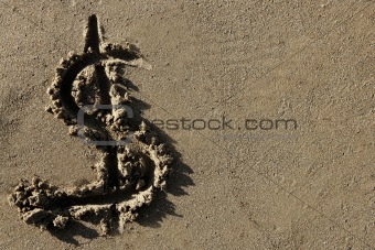 American currency  dollar sign on the beach sand