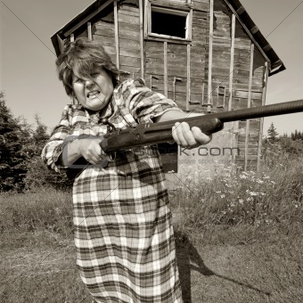 Angry woman with big gun