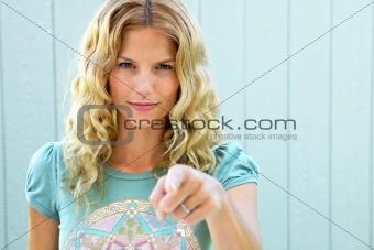 Pretty girl pointing her finger accusingly