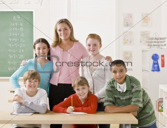 Teacher posing with students