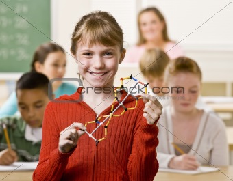 Student holding helix in classroom