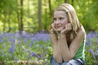 Child and bluebells