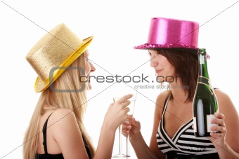 Two casual young women enjoying champagne