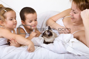 Happy family with their little kitten