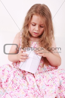 Little girl opening present