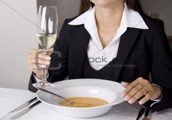 Business woman is having lunch