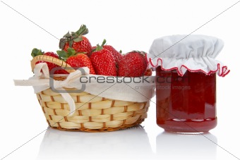 Jam jar and basket of strawberries