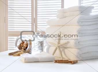 Fluffy white towels on table 