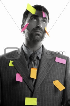 Businessman full of memo stock message notes