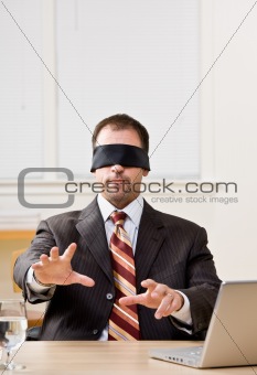 Businessman in blindfold
