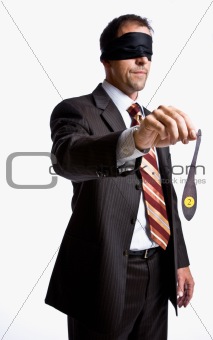 Businessman in blindfold with donkey tail