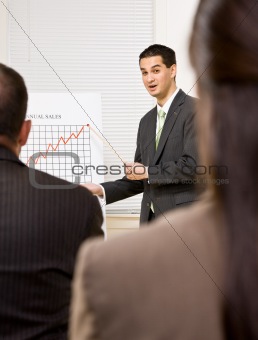 Businessman explaining chart