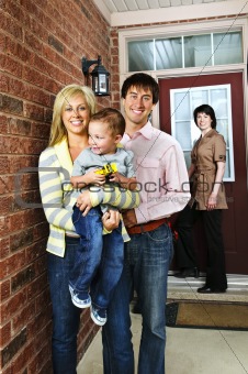 Happy family with real estate agent