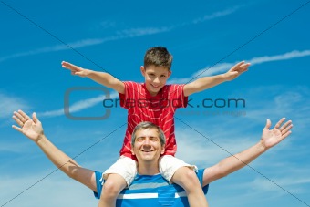 father and his son play outdoors