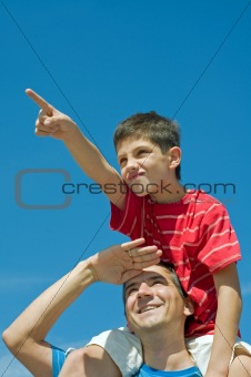 father and his son play outdoors