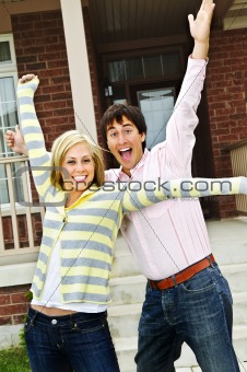 Excited couple at home