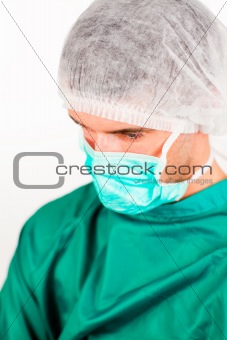 Thoughtful surgeon in scrubs uniform