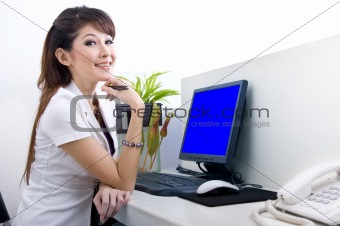 beautiful secretary with blank computer screen