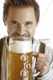 Bavarian man holding Oktoberfest beer stein