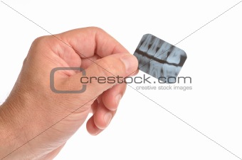 Dentist hand holding x-ray isolated