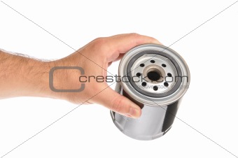 Hand holding automotive oil filter
